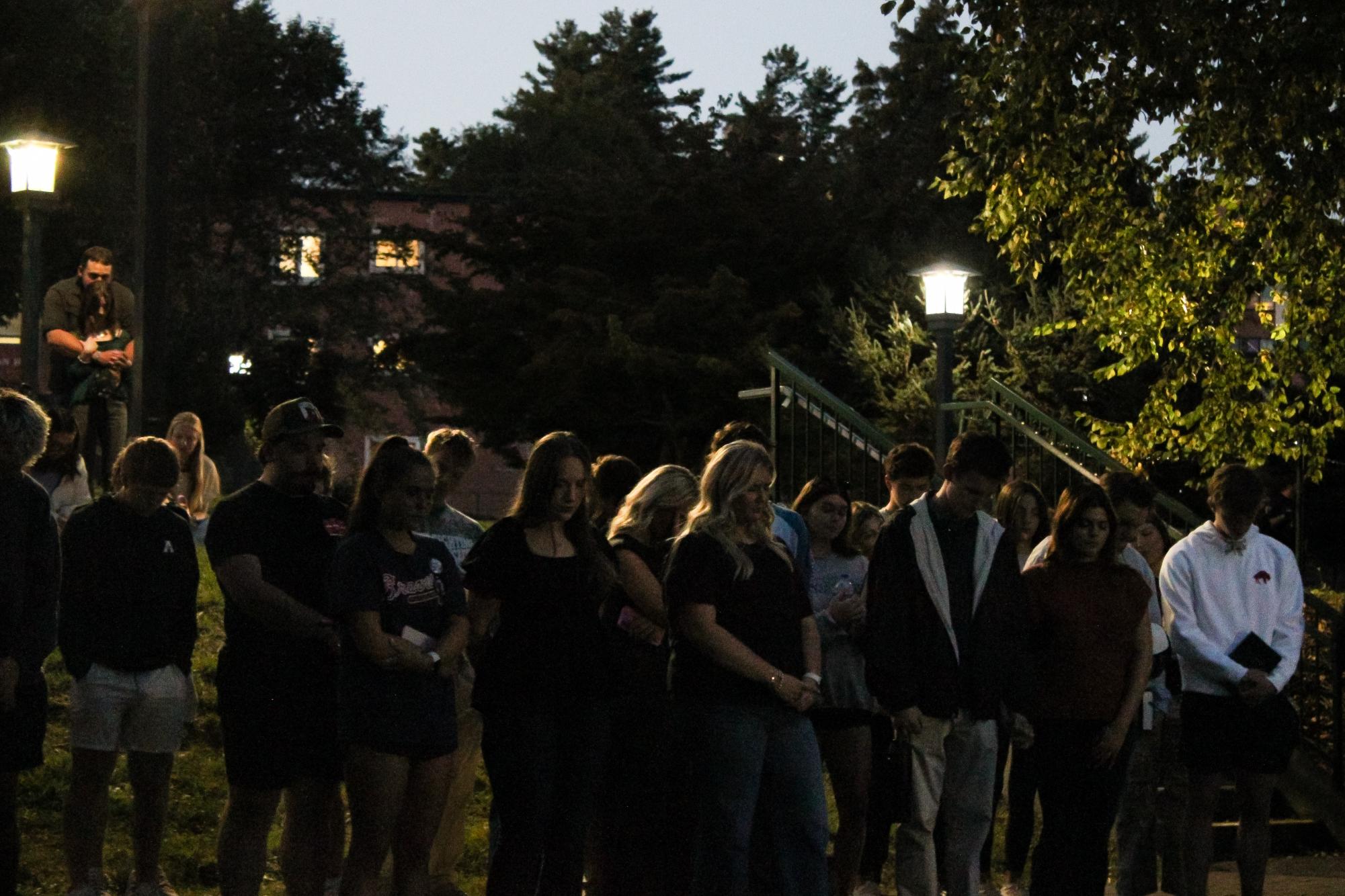 Students, families and faculty bow their heads in a moment of silence on Sept. 11. 