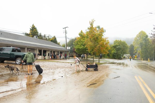  Boone residents carry children and animals away from the wreckage of Hurricane Helene on Sept. 28 2024. 