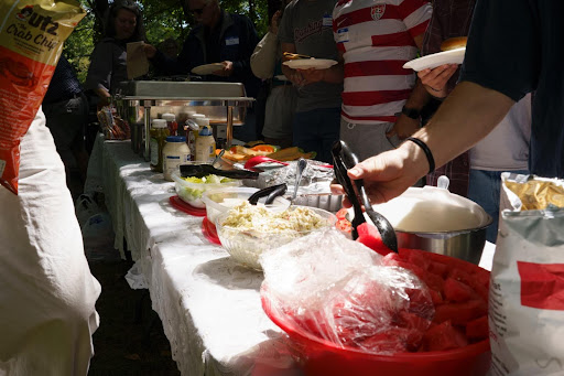 Attendees enjoy food spread at the Watauga Democrats Labor Day Cookout, Sep. 3.
