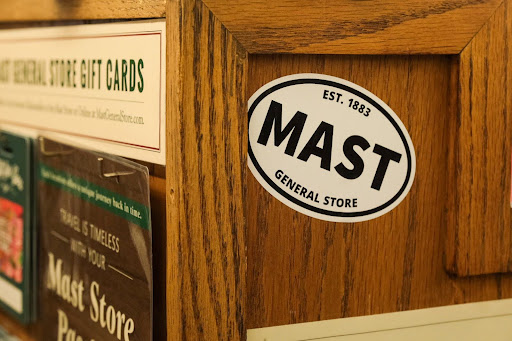 A Mast General Store sticker adorns the downstairs register in the Boone Mast General, Sept. 3. 