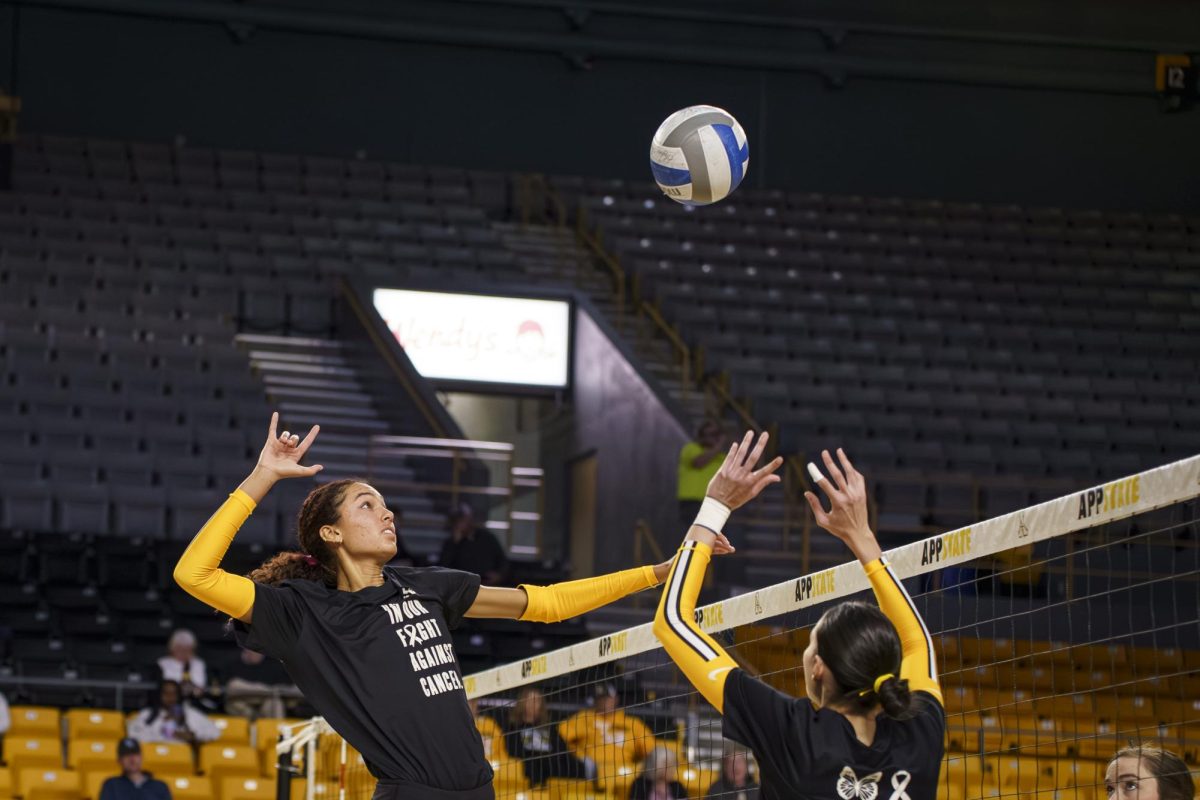 Senior middle blocker Maya Winterhoff spikes at the App State volleyball vs. Old Dominion University game in Holmes Convocation Center on Oct. 10.