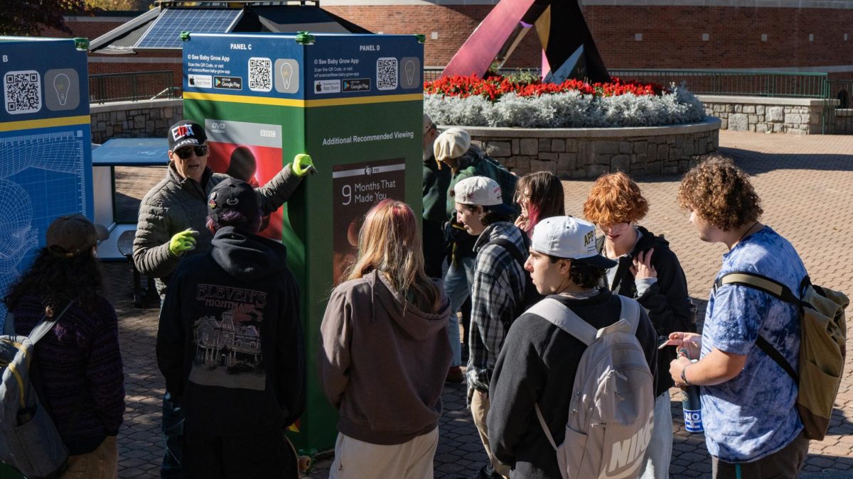 Charles Armstrong discusses the Maternal-Fetal Health demonstration with students on Sanford Mall on Oct. 20
