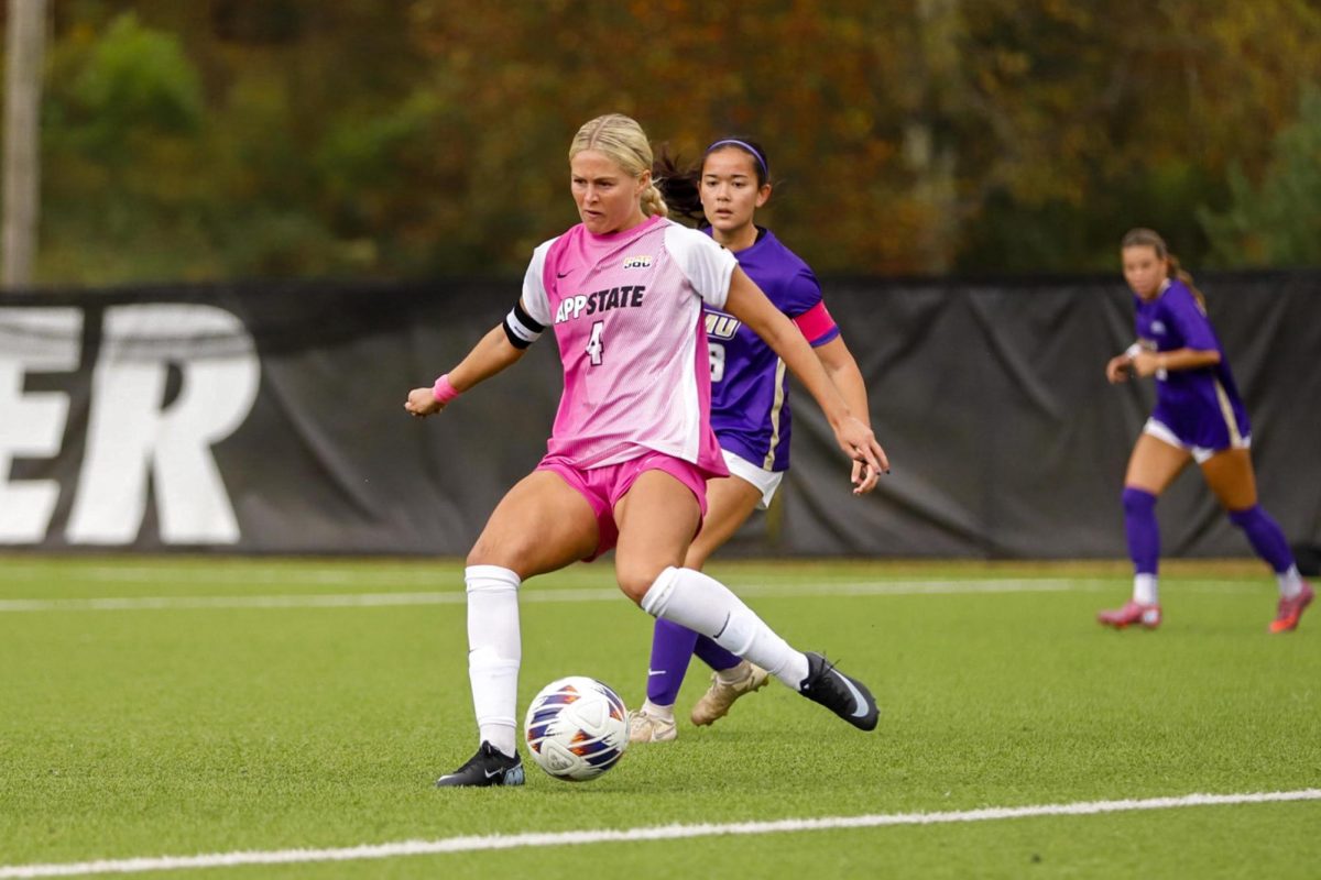 Grad student Izzi Wood drives the offense with a pass in Sunday's home game against JMU. Wood is the top offensive player this season with 4 goals so far.