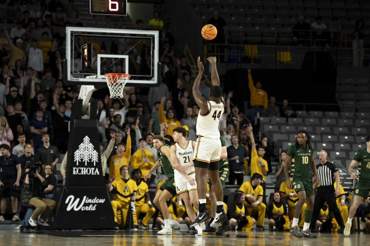  Sophomore forward Michael Marcus Jr. takes a shot from the 3-point line in Holmes Convocation Center on Nov. 21. 