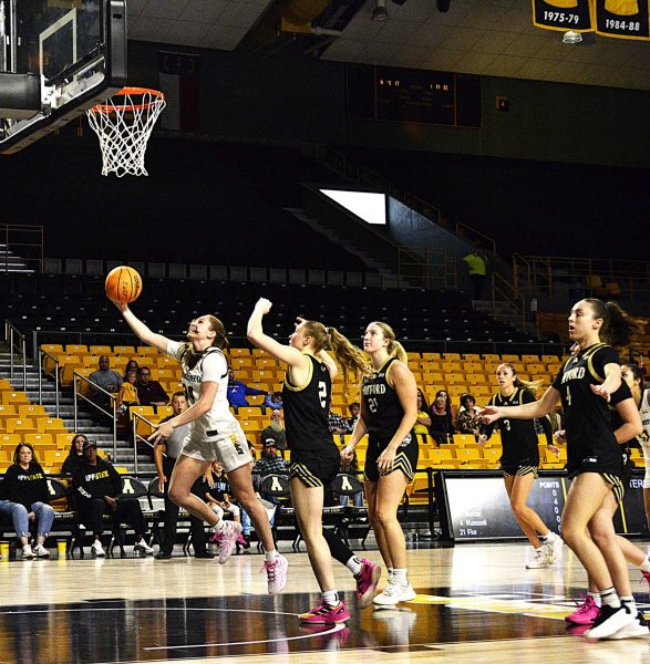 Senior guard Emily Hege breaks away for a layup in App State’s game against Wofford College at Holmes Convocation Center on Nov. 16. During this game, Hege made 4 field goals, 3 3-point shots and 2 assists against their opponents.