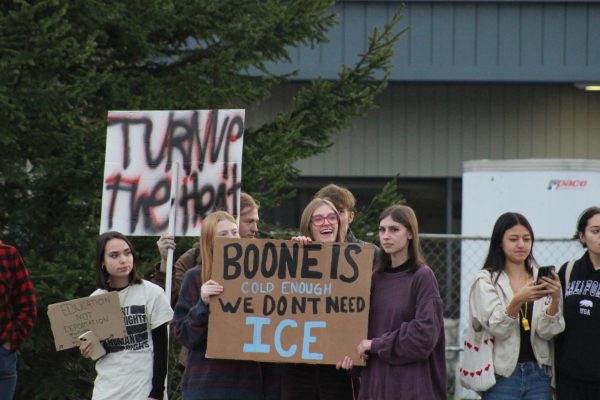 Boone protesters hold signs against ICE on Blowing Rock Road on Nov. 18.