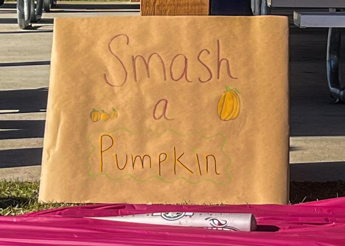 The sign for the “Smash a Pumpkin” station at NAMI On Campus’ Fall Fest, hosted at the Boone Greenway on Nov. 14.