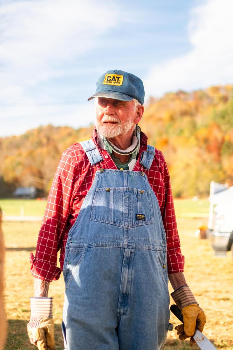 A volunteer sets up and begins making apple butter for the Valle Country Fair in Valle Crucis on Oct. 17. 