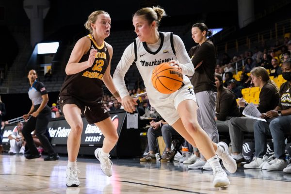 Senior guard Emma Smith dribbles down the court at Holmes Convocation Center on Nov. 5. 