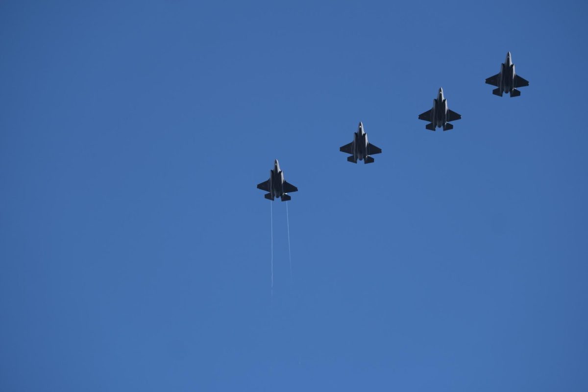 Jets perform a flyover during the national anthem at Kidd Brewer Stadium on Nov. 22.
