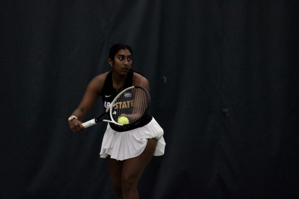Freshman Sreenidhi Balaji goes for a serve during her doubles match with freshman Allegra Hodson against Austin Peay on Feb. 21. Together they won the point in this match with a 6-3. 