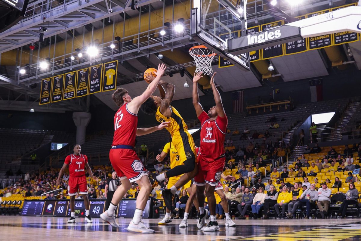 Graduate Student Kasen Jennings reaches for a layup against South Alabama on Feb. 4 at the Holmes Convocation Center.