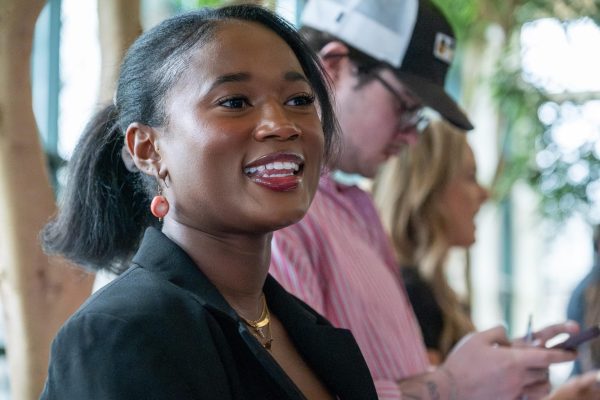 Student body vice presidential candidate Yauri Hatcher speaks with Student Government Association members during a campaigning event held in the Plemmons Student Union  Solarium on March 18. 