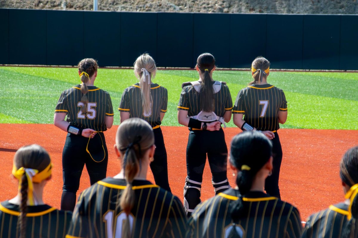 App State outfielders standing for the national anthem at the Sywassink/Lloyd Family Stadium during the Mountaineer Classic on March 7.
