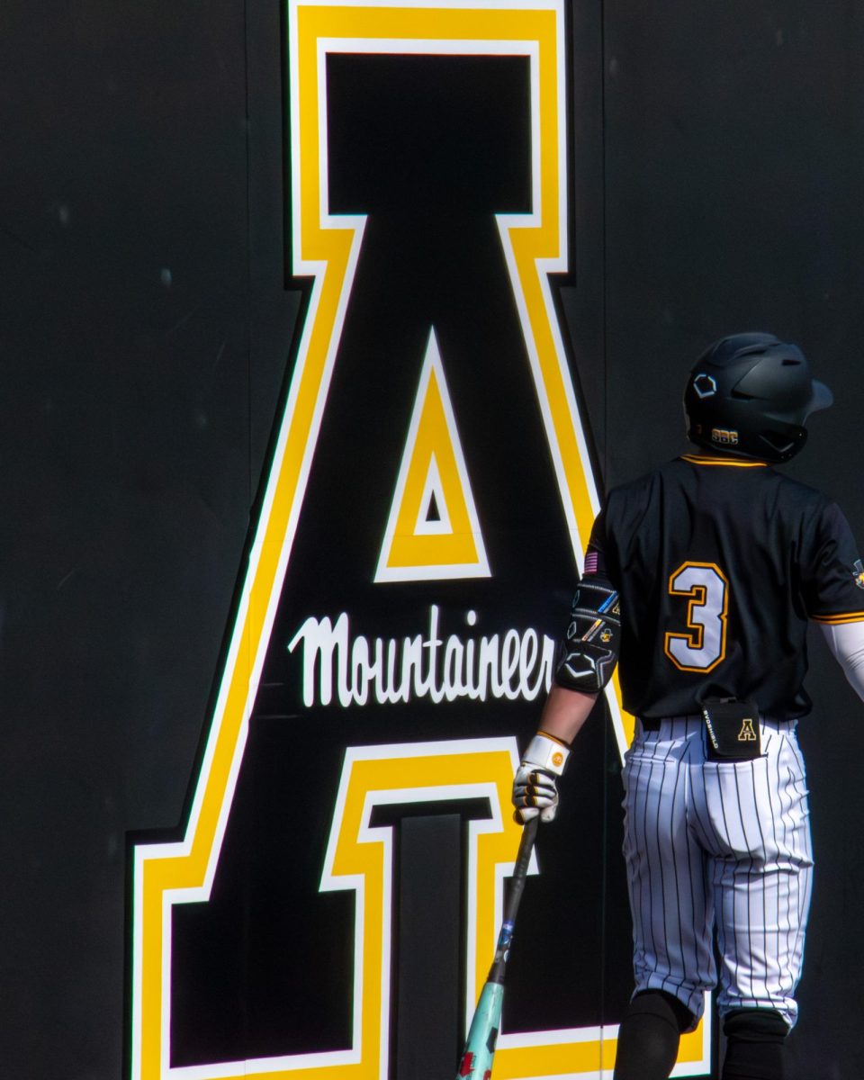 Senior outfielder Charlie Evans warming up to bat at the bottom of the fourth before getting on base and making it to home by RBI at Beaver Field at Jim and Bettie Smith Stadium on March 14.
