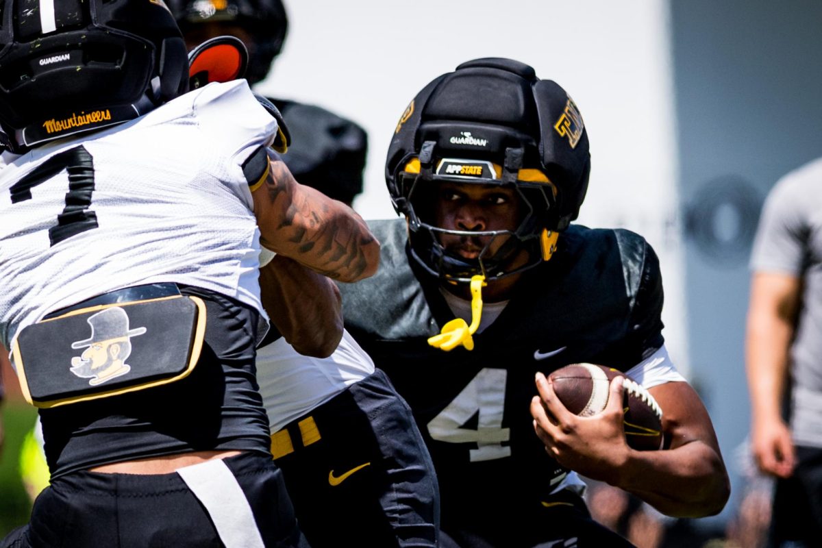 Redshirt junior running back Treyaun Webb runs the football at Kidd Brewer Stadium on April 18.
