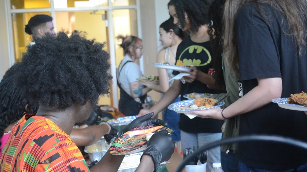 Students attending the "A Taste of Home" event in Plemmons Student Union on April 14 wait their turn for a plate of food.