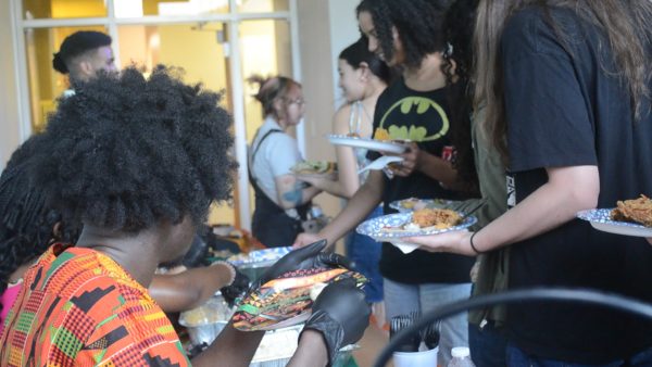 Students attending the "A Taste of Home" event in Plemmons Student Union on April 14 wait their turn for a plate of food.