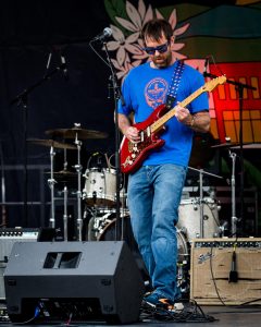 Guitarist for Marvelous Funkshun plays for Boonerang attendees at the South Depot stage on June 20.